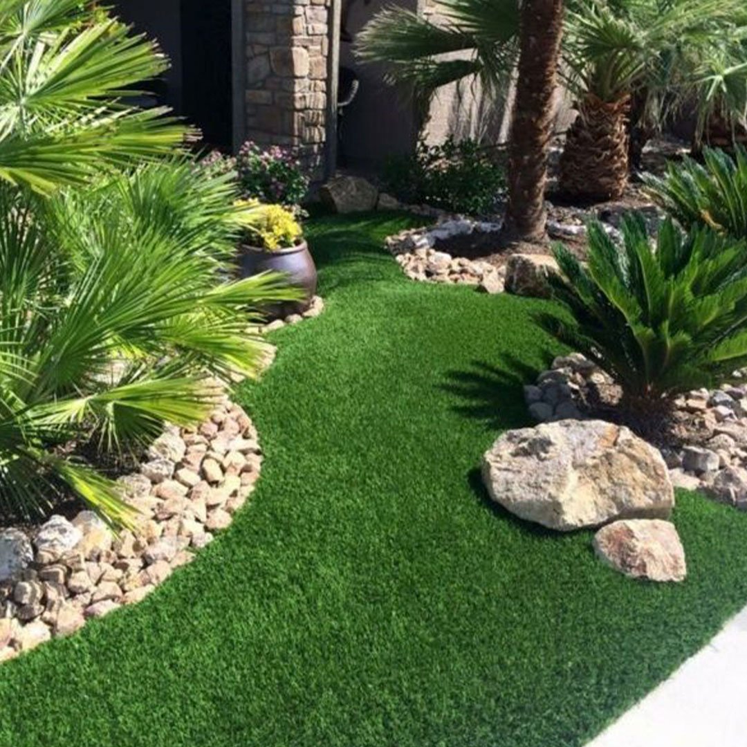 Professional artificial grass installation in a luxury Del Mar backyard.