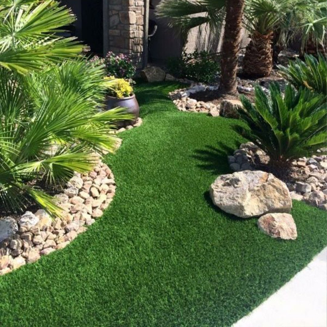 Professional artificial grass installers in Del Mar, CA, completing a luxury backyard turf project.