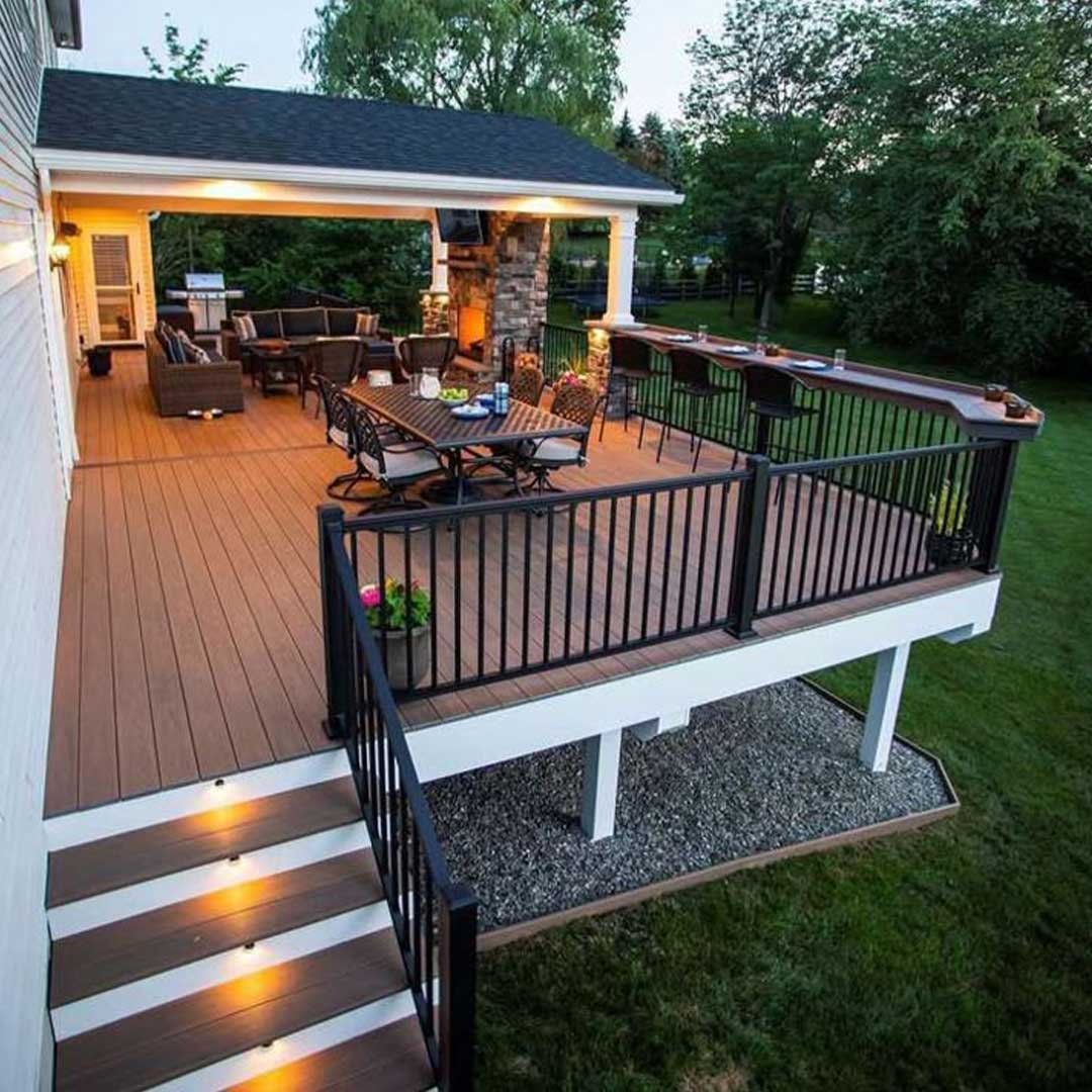 A custom-engineered luxury deck with glass railings overlooking the Del Mar coast, built by Specialized Landscape & Construction.